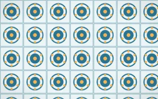 Algarve Sea Medallion Tile — light blue, orange and white azulejo background
