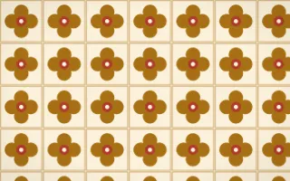 Fes Saffron Quatrefoil Tile — light brown, red and beige azulejo background