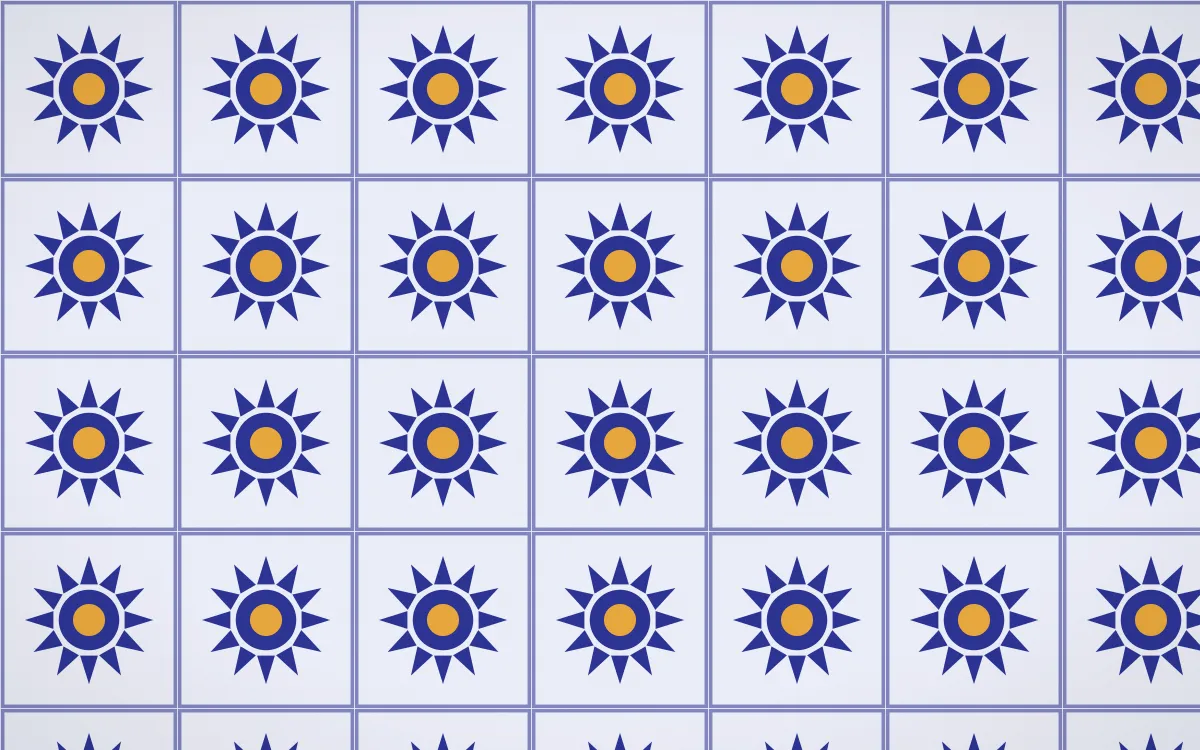 Majorelle Sunburst Tile — light blue, gold and white azulejo background