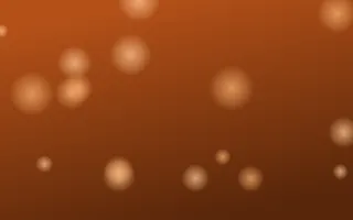 Tangelo Glow — dark brown and orange bokeh background