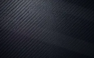 Carbon Blue Hour — dark purple and black carbon fibre background
