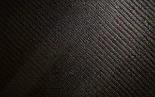 Carbon Candle Glow — dark black carbon fibre background