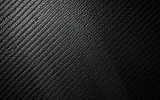 Carbon Editorial — dark black carbon fibre background