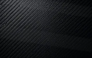 Carbon Low Key — dark black carbon fibre background