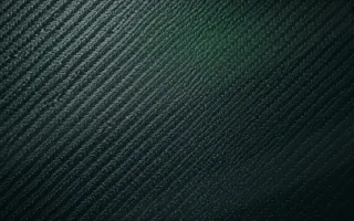 Carbon Moonlit — dark green and black carbon fibre background