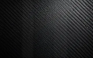 Carbon Museum Light — dark grey and black carbon fibre background