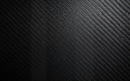 Carbon Museum Light — dark grey and black carbon fibre background