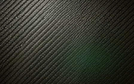 Carbon Warm Studio — dark green and black carbon fibre background