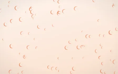Peach Fuzz Moons — light orange and white celestial background