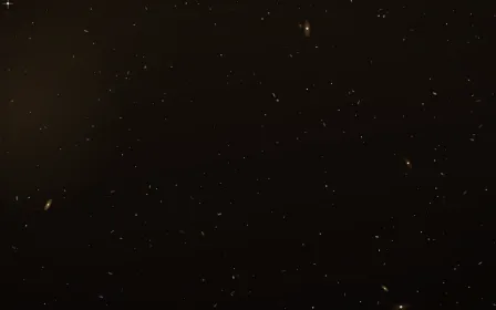 Galactic Core Deep Field — dark black, brown and orange galaxy background