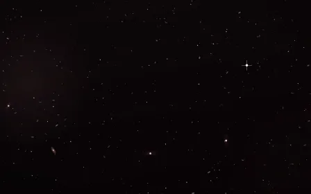 Dusty Rose Halo Deep Field — dark black and red galaxy background