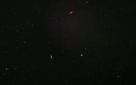 Abell Bloom Deep Field — dark black and pink galaxy background