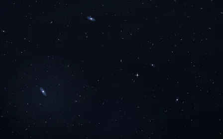 Copper On Cobalt Deep Field — dark black, brown and blue galaxy background
