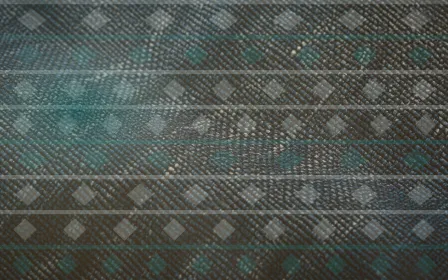 Ikat Afterglow — colourful teal and gold ikat background