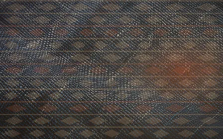 Kente Editorial — colourful orange strip-weave background