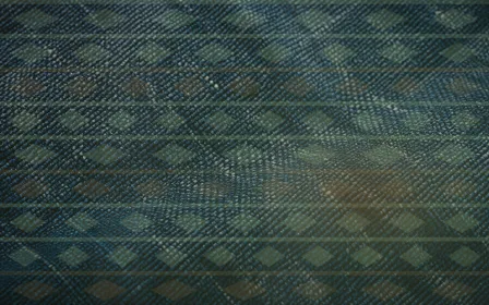 Kente Softbox — colourful brown and green strip-weave background