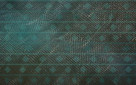 Kilim Afterglow — colourful teal and gold kilim background