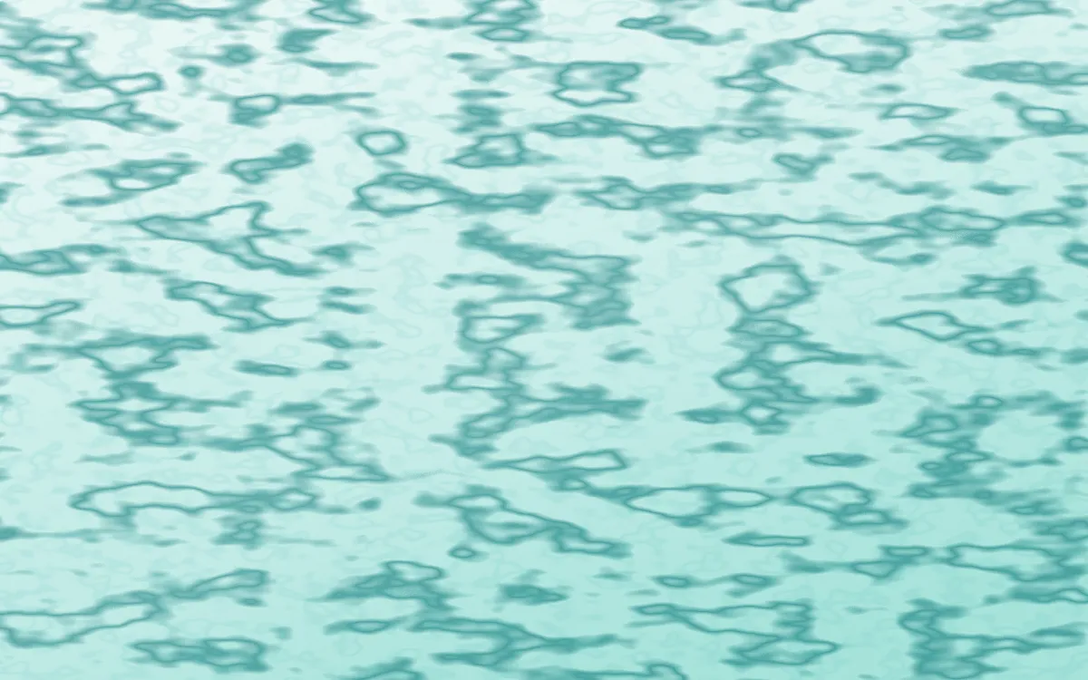 Cancún Surf Veined Marble — light teal marble background
