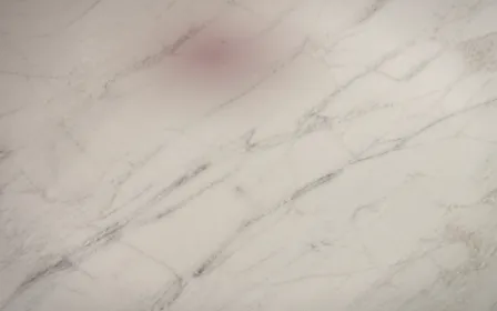 Marble Candle Glow — dark red, beige and green marble background