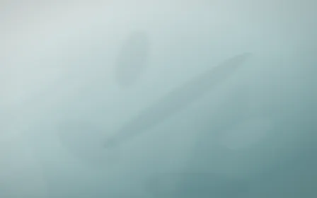 Coastal Mist Plaster — light white and teal plaster wall background