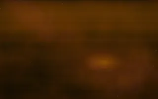Gold Dust Nebula — dark black, orange and brown space background