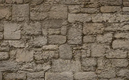 Stonewall Candle Glow — dark orange and brown stone wall background