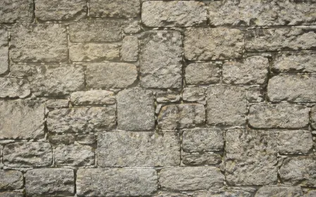 Stonewall Dawn Mist — light beige stone wall background
