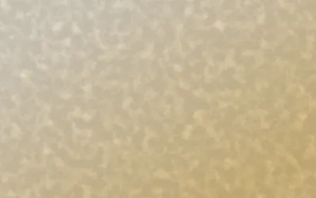 Sevilla Ochre Plaster — light beige and yellow textured background